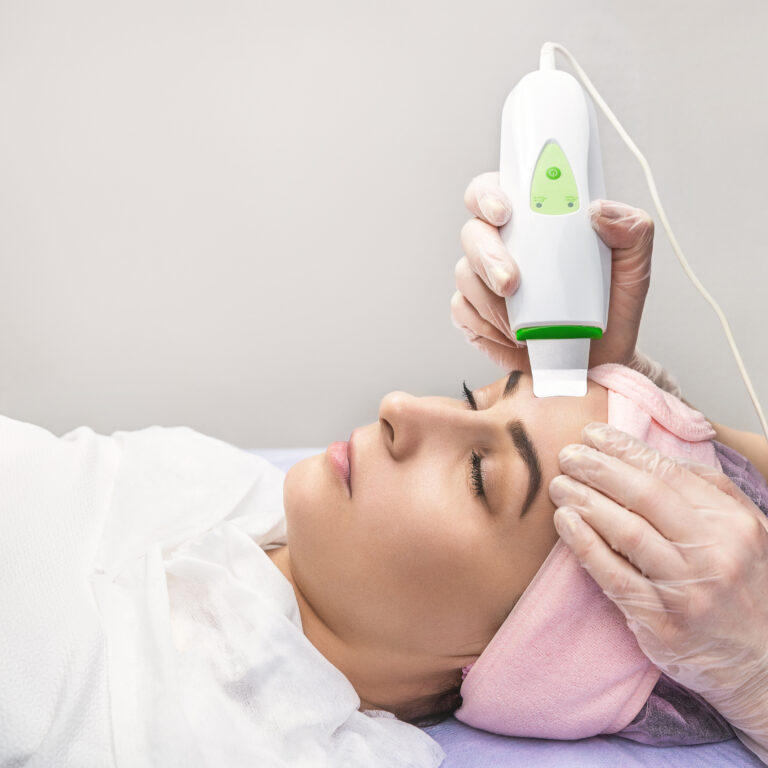 woman-receiving-cleansing-therapy-with-professional-ultrasonic-equipment